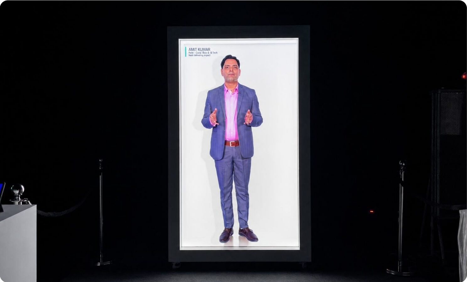 A HoloBox 911 showing a life-size presenter on stage